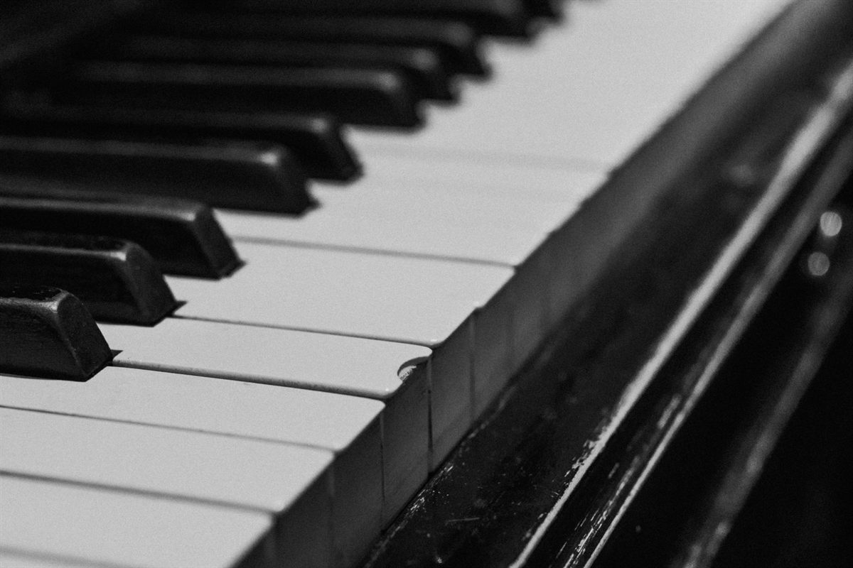 Black and white piano keys in close view, in monochrome