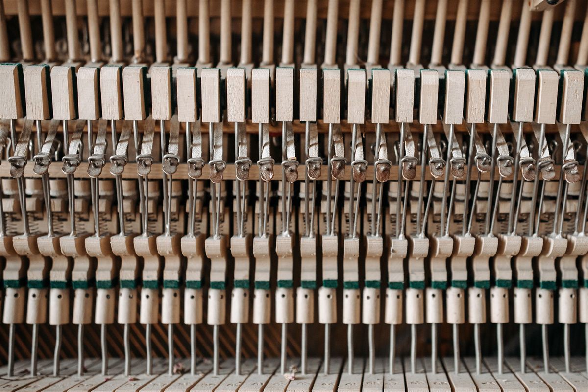 Piano hammers and dampers inside an upright action